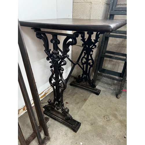 1021 - Two Victorian style cast metal stained wood topped tavern tables, larger width 120cm, depth 60cm, he... 