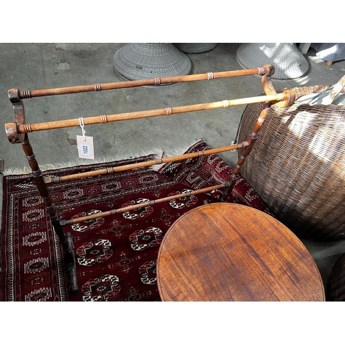 1022 - A Victorian mahogany towel rail, height 82cm and a Victorian and later circular occasional table... 