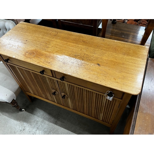 1034 - A mid century teak small sideboard, width 114cm, depth 43cm, height 89cm