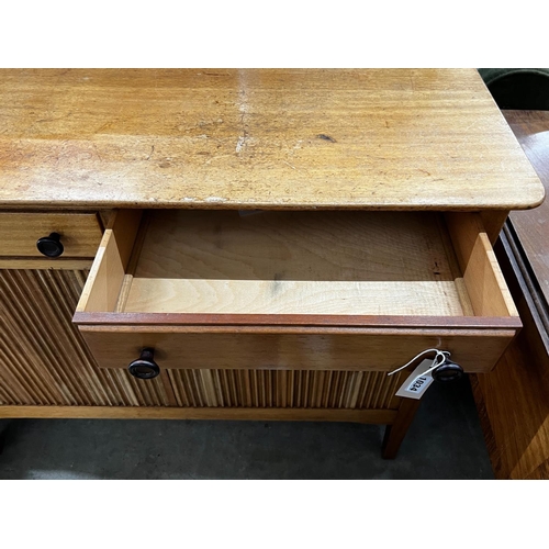 1034 - A mid century teak small sideboard, width 114cm, depth 43cm, height 89cm