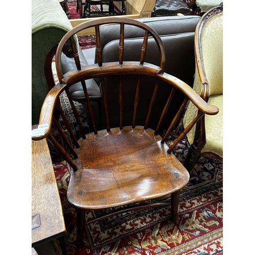 1039 - An early 20th century Windsor ash and elm comb back elbow chair, width 66cm, depth 41cm, height 92cm... 