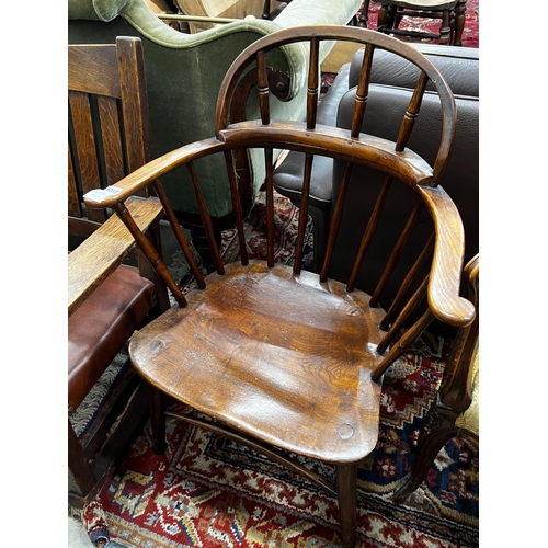 1039 - An early 20th century Windsor ash and elm comb back elbow chair, width 66cm, depth 41cm, height 92cm... 