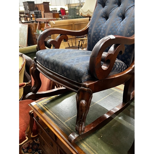 1042 - A Victorian carved mahogany upholstered rocking elbow chair, width 53cm, depth 76cm, height 104cm... 