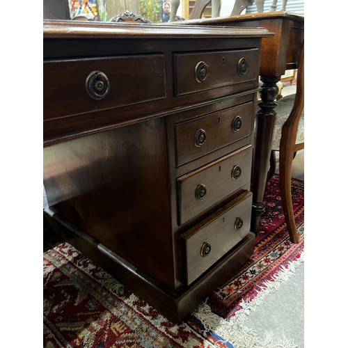 1044 - An early 20th century mahogany leather topped pedestal desk, width 137cm, depth 75cm, height 74cm... 