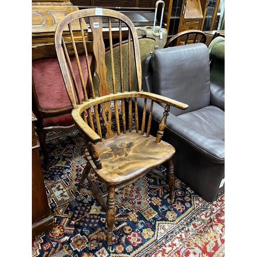 1050 - A Victorian ash, elm and beech Windsor armchair, width 57cm, depth 38cm, height 110cm