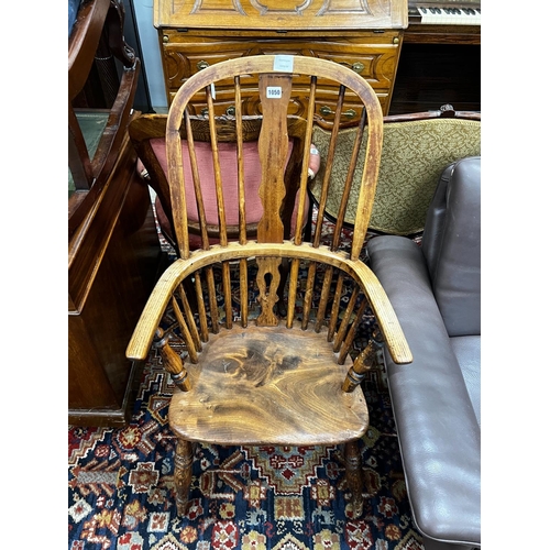 1050 - A Victorian ash, elm and beech Windsor armchair, width 57cm, depth 38cm, height 110cm