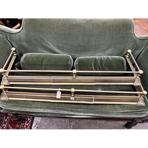 1053 - A pair of Victorian style telescopic brass fenders