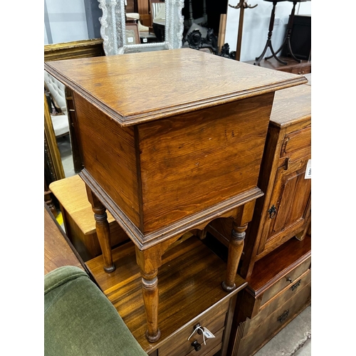 1054 - A mid century teak three drawer bedside chest, height 77cm together with an oak and pine workbox... 