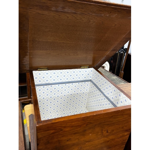 1054 - A mid century teak three drawer bedside chest, height 77cm together with an oak and pine workbox... 