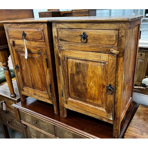 1055 - A pair of Indonesian hardwood bedside cabinets, width 43cm, depth 31cm, height 64cm