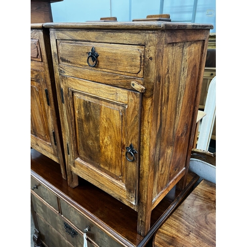 1055 - A pair of Indonesian hardwood bedside cabinets, width 43cm, depth 31cm, height 64cm