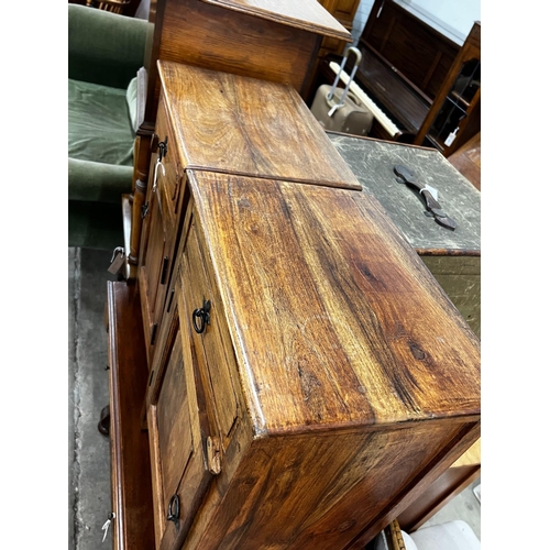 1055 - A pair of Indonesian hardwood bedside cabinets, width 43cm, depth 31cm, height 64cm