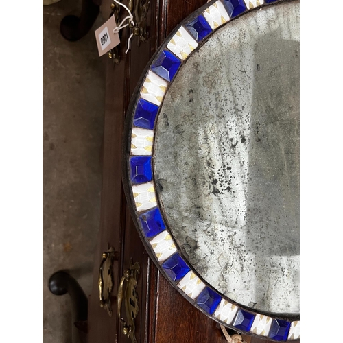 1058 - An oval Irish style wall mirror, width 41cm, height 51cm