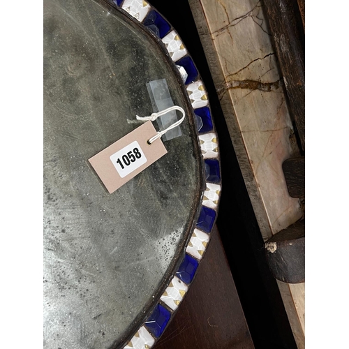 1058 - An oval Irish style wall mirror, width 41cm, height 51cm