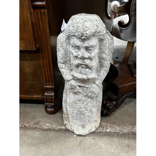 1059 - Two medieval style carved stone corbels, height 48cm