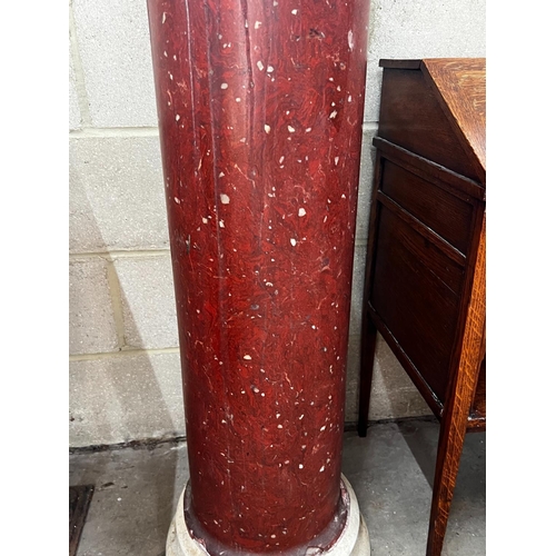 1068 - A faux porphyry column with circular marble top, height 104cm