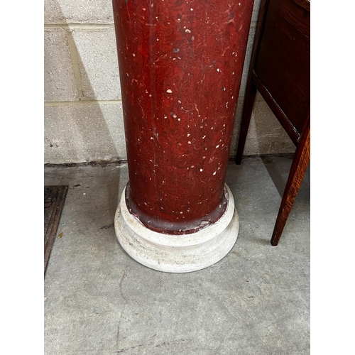 1068 - A faux porphyry column with circular marble top, height 104cm