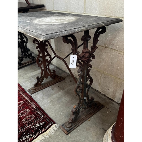 1072 - A rectangular cast iron marble topped garden table, length 92cm, depth 54cm, height 69cm