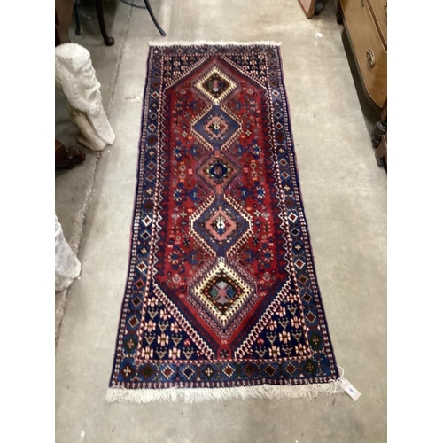 1087 - A Caucasian style red ground runner 200cm x 76cm