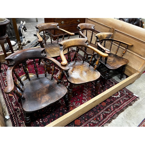 1090 - A harlequin set of five Victorian elm and beech smoker's bow chairs