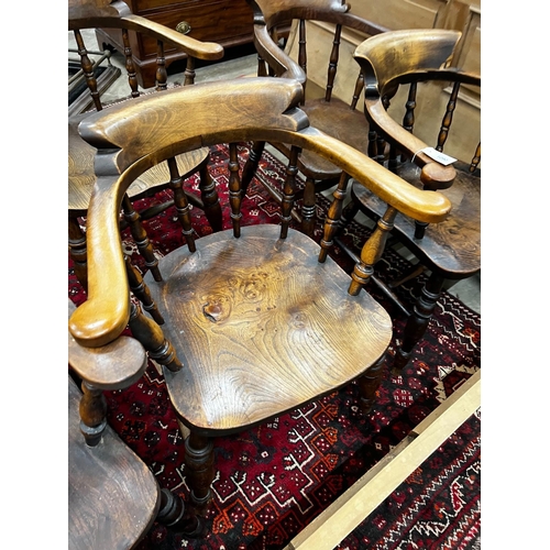 1090 - A harlequin set of five Victorian elm and beech smoker's bow chairs