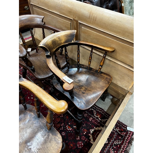 1090 - A harlequin set of five Victorian elm and beech smoker's bow chairs