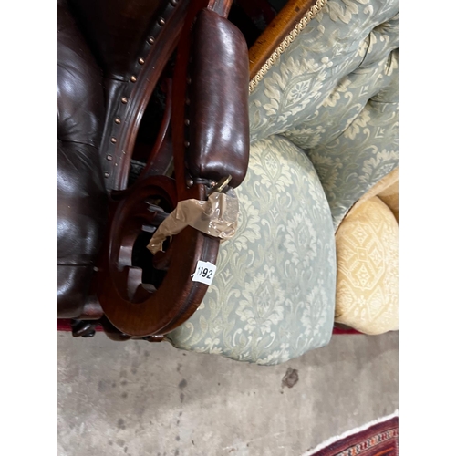 1092 - A Victorian mahogany armchair upholstered in deep buttoned brown leather, width 68cm, depth 80cm, he... 