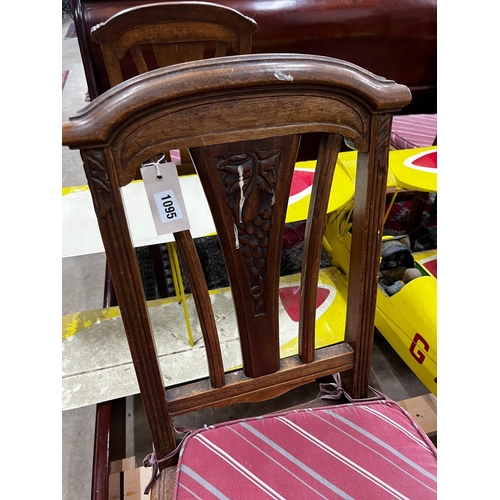 1095 - A set of four early 20th century French walnut dining chairs