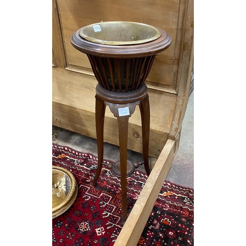 1111 - An Edwardian inlaid mahogany jardiniere with brass liner, height 93cm