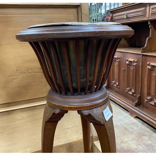 1111 - An Edwardian inlaid mahogany jardiniere with brass liner, height 93cm