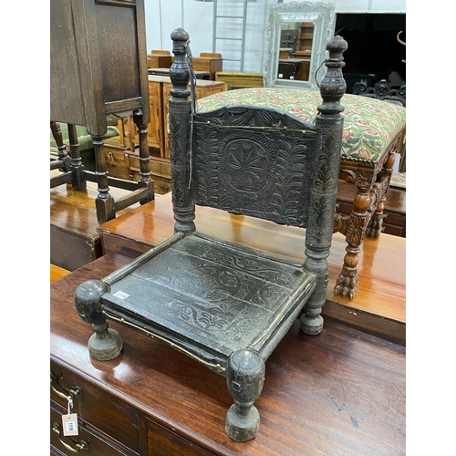 1118 - An Indian chip carved hardwood low seat chair, width 46cm, depth 43cm, height 71cm