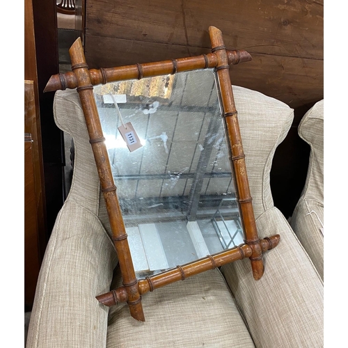 1131 - A late Victorian faux bamboo rectangular frame wall mirror, width 56cm, height 74cm