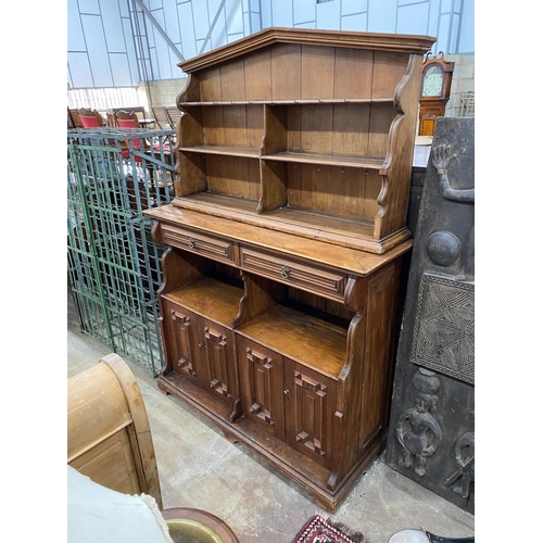 1136 - An Arts and Crafts pine buffet with arched top, width 150cm, depth 46cm, height 205cm