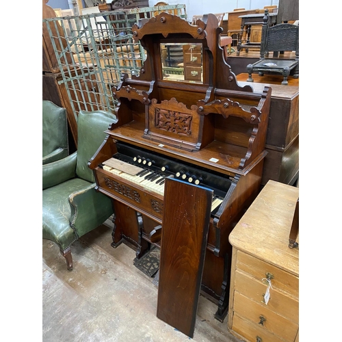 1140 - A late 19th century American mahogany cased chapel organ, width 104cm, depth 48cm, height 160cm... 