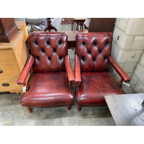 1148 - A pair of Victorian style button back burgundy leather Howard style open armchairs, width 69cm, dept... 