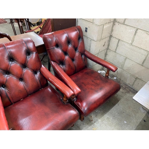 1148 - A pair of Victorian style button back burgundy leather Howard style open armchairs, width 69cm, dept... 