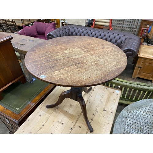 1159 - A George III style circular oak tripod tea table, diameter 76cm, height reduced 67cm