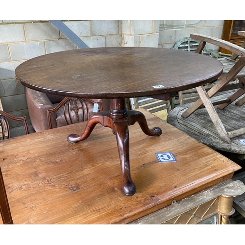 1173 - A George III circular mahogany tripod tea table, cut down, diameter 92cm, height 52cm