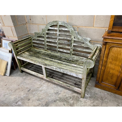 1199 - A Lutyens style weathered teak garden bench, length 165cm, depth 64cm, height 101cm