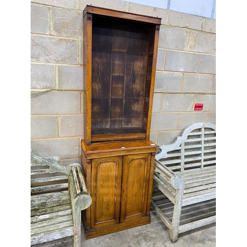 1200 - A Victorian narrow oak bookcase cupboard, width 72cm, depth 34cm, height 208cm