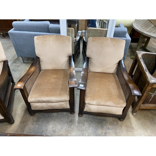 1207 - A 1930's oak and single caned three piece bergere suite