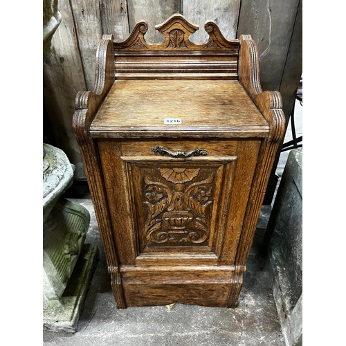 1216 - A Victorian carved oak coal purdonium, width 38cm, depth 35cm, height 75cm