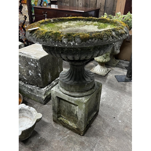 1217 - A reconstituted stone circular campana planter on square plinth, diameter 80cm, height 102cm