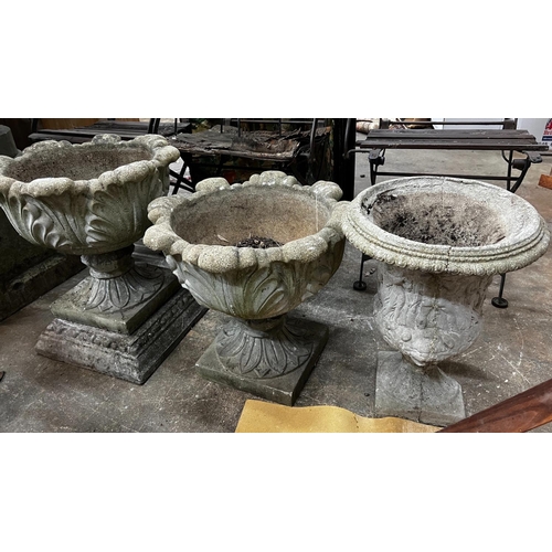 1218 - Three circular reconstituted stone garden urns, the largest diameter 48cm, height 55cm