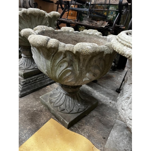 1218 - Three circular reconstituted stone garden urns, the largest diameter 48cm, height 55cm