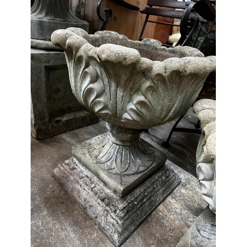 1218 - Three circular reconstituted stone garden urns, the largest diameter 48cm, height 55cm