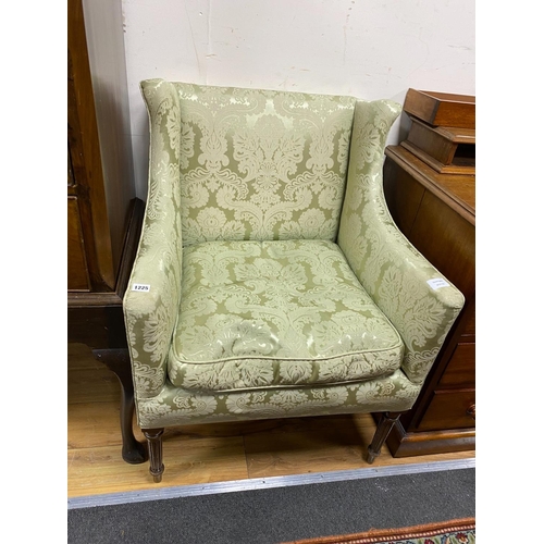 1225 - A small Edwardian mahogany upholstered wing armchair, covered in a pale green damask material, width... 