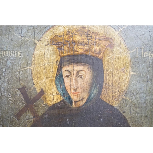 1717 - 19th century Russian School, tempera on panel, Icon of a female saint, 62 x 58cm