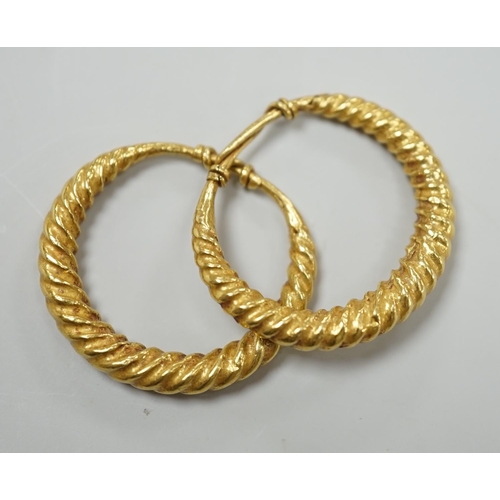 1964 - A pair of possibly Roman? yellow metal spiral twist loop earrings, 30mm, 8 grams.