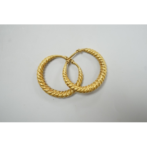 1964 - A pair of possibly Roman? yellow metal spiral twist loop earrings, 30mm, 8 grams.